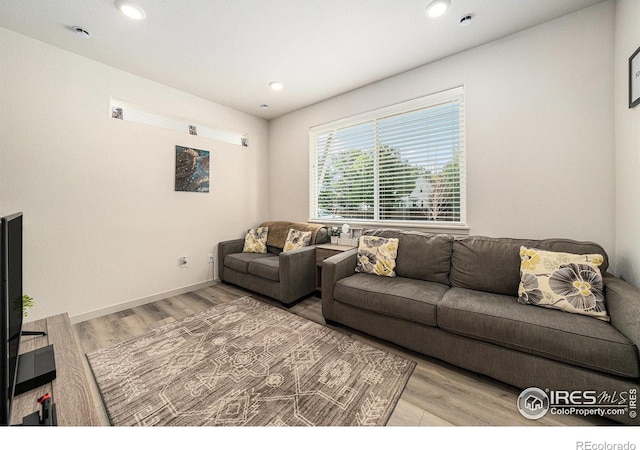 1099 Spartan Ave, Berthoud, CO 80513 - living room featuring wood finished floors and recessed lighting