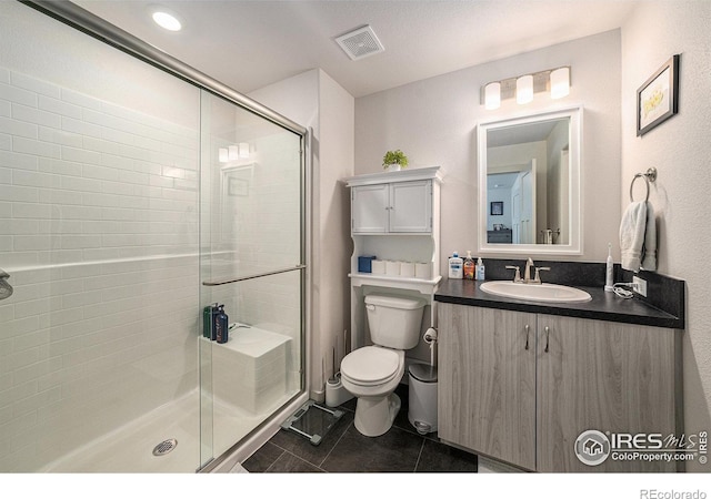 1099 Spartan Ave, Berthoud, CO 80513 - full bath with toilet, vanity, tile patterned flooring, and a stall shower