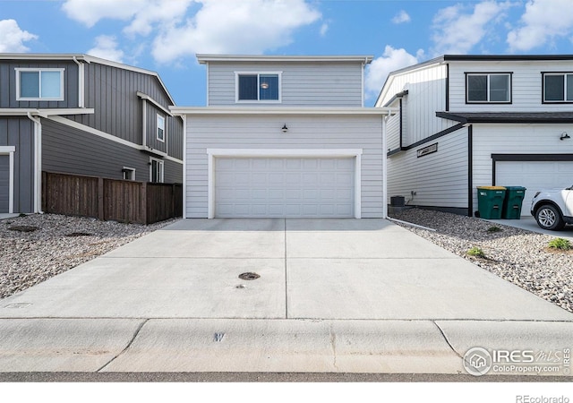 1099 Spartan Ave, Berthoud, CO 80513 - traditional-style house featuring a garage and concrete driveway