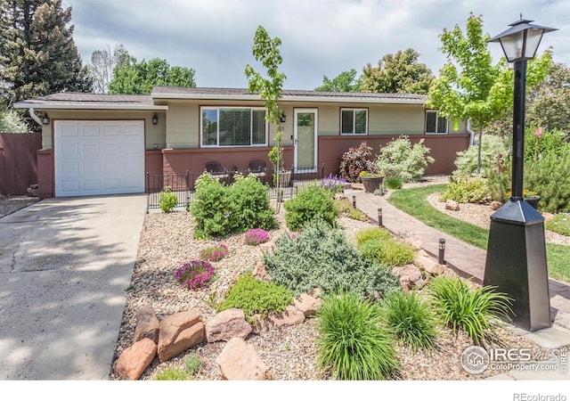 501 Copeland Way, Longmont, CO 80504 - ranch-style house with a garage and driveway