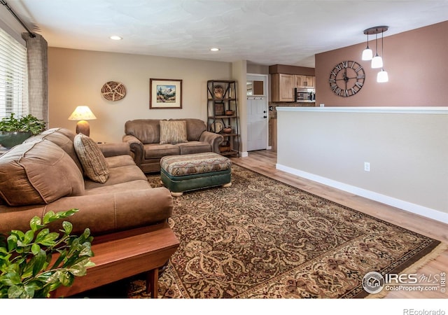 501 Copeland Way, Longmont, CO 80504 - living area featuring light wood finished floors, baseboards, and recessed lighting