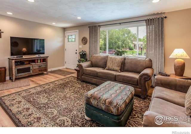 501 Copeland Way, Longmont, CO 80504 - living area with wood finished floors, recessed lighting, and baseboards