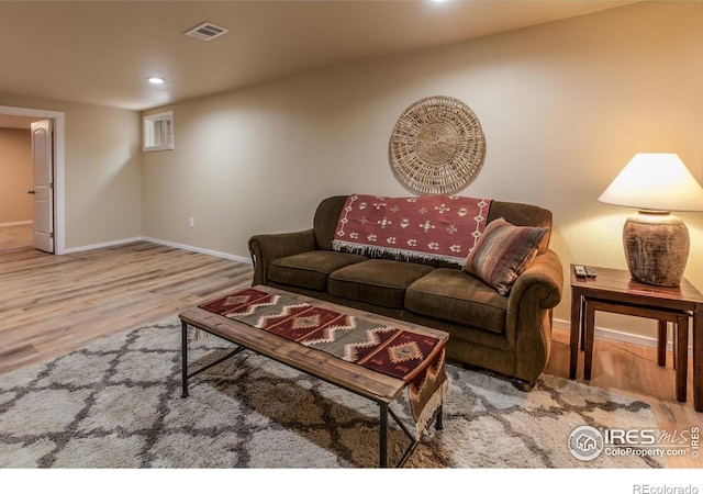 501 Copeland Way, Longmont, CO 80504 - living room with wood finished floors, baseboards, and recessed lighting