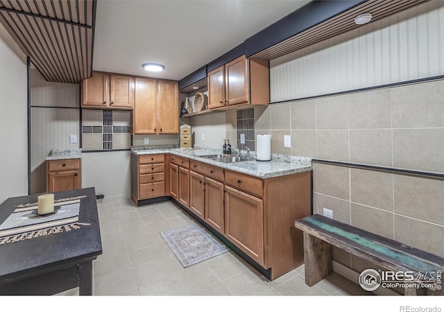 501 Copeland Way, Longmont, CO 80504 - kitchen featuring open shelves, a sink, brown cabinets, and light tile patterned flooring