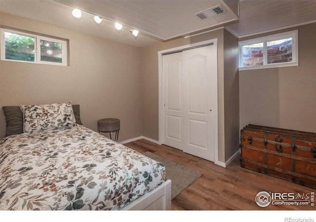 501 Copeland Way, Longmont, CO 80504 - bedroom with wood finished floors, a closet, and baseboards