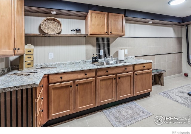 501 Copeland Way, Longmont, CO 80504 - kitchen with a sink, open shelves, light tile patterned floors, and brown cabinets
