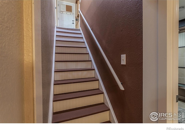 501 Copeland Way, Longmont, CO 80504 - staircase featuring a textured wall