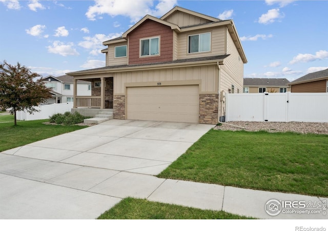 978 Mouflon Dr, Severance, CO 80550 - craftsman house with board and batten siding, a garage, stone siding, driveway, and a porch