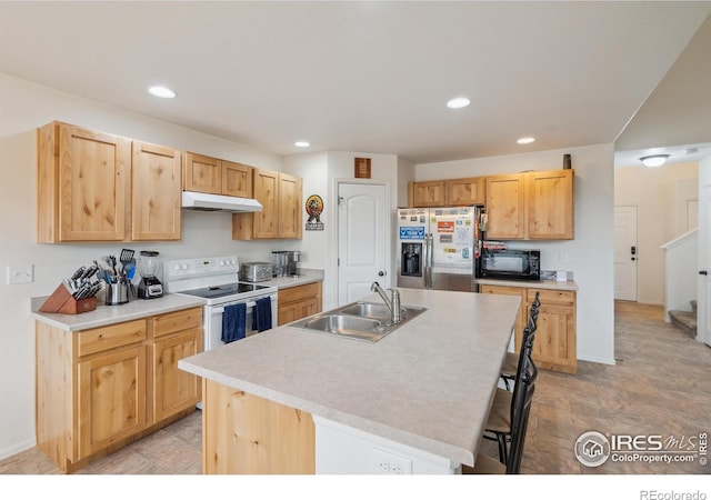 978 Mouflon Dr, Severance, CO 80550 - kitchen featuring stainless steel refrigerator with ice dispenser, white range with electric cooktop, a sink, under cabinet range hood, and black microwave