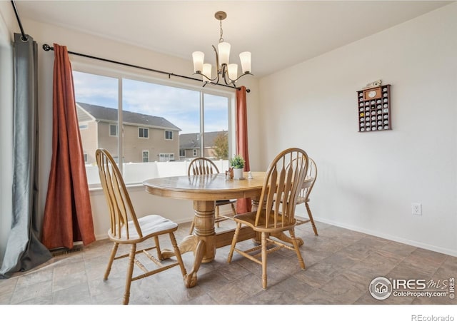 978 Mouflon Dr, Severance, CO 80550 - dining space featuring a chandelier and baseboards