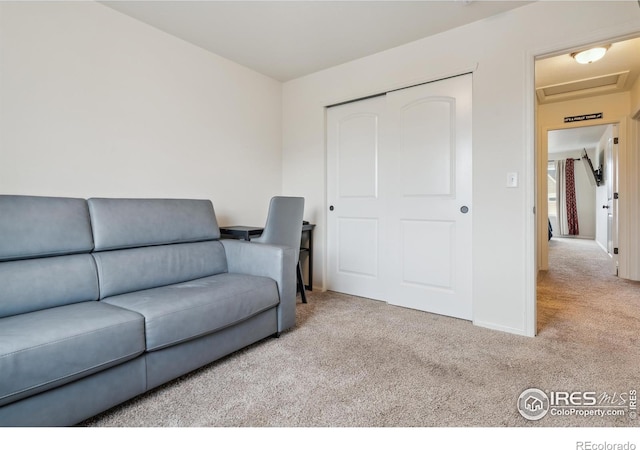 978 Mouflon Dr, Severance, CO 80550 - living room featuring carpet floors, baseboards, and attic access
