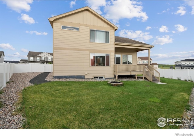 978 Mouflon Dr, Severance, CO 80550 - back of property featuring board and batten siding and a wooden deck