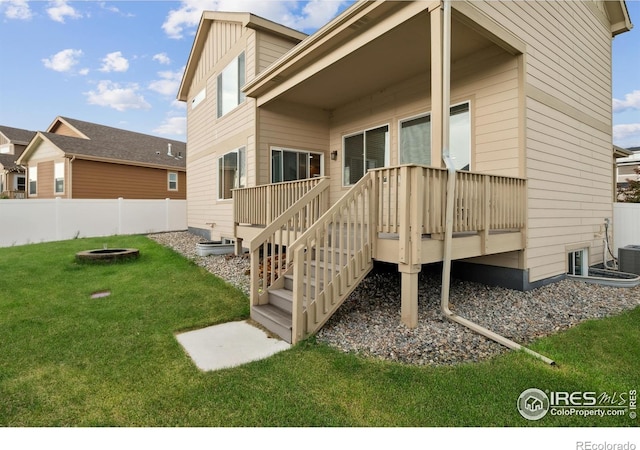 978 Mouflon Dr, Severance, CO 80550 - rear view of property with a fire pit, a deck, and stairway