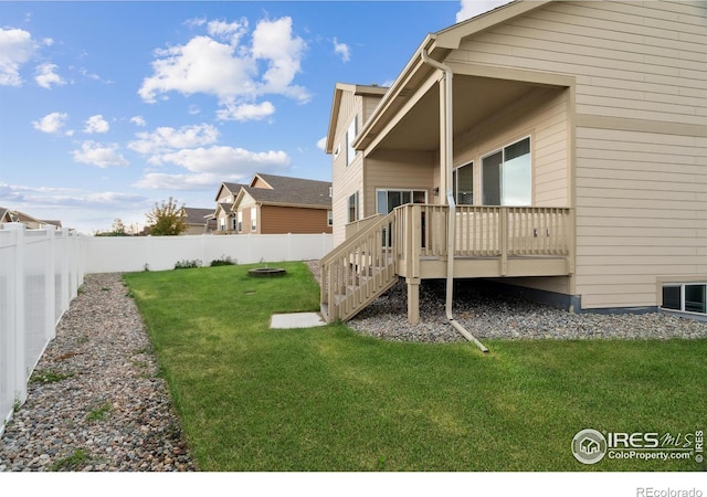 978 Mouflon Dr, Severance, CO 80550 - view of yard featuring a deck and central AC