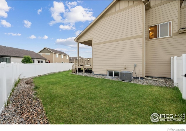 978 Mouflon Dr, Severance, CO 80550 - rear view of property featuring central AC unit and board and batten siding