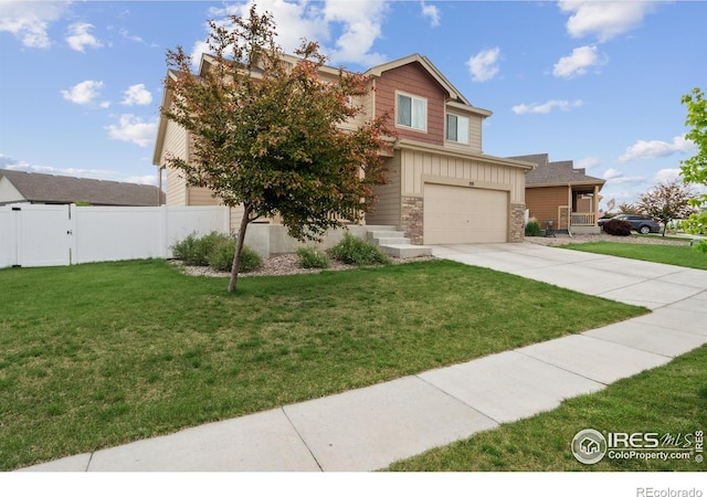978 Mouflon Dr, Severance, CO 80550 - view of front of home with driveway, an attached garage, and board and batten siding
