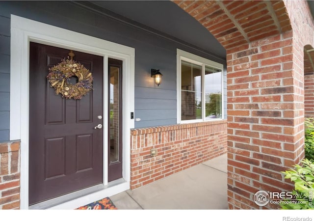 6492 Richland Ave, Timnath, CO 80547 - property entrance with brick siding and covered porch