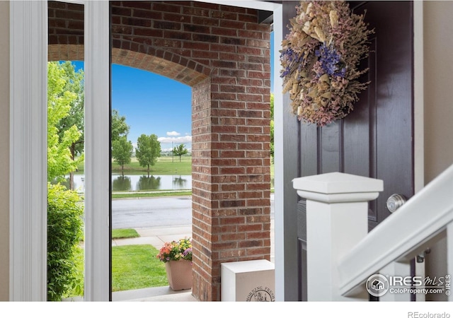 6492 Richland Ave, Timnath, CO 80547 - doorway to property featuring a water view