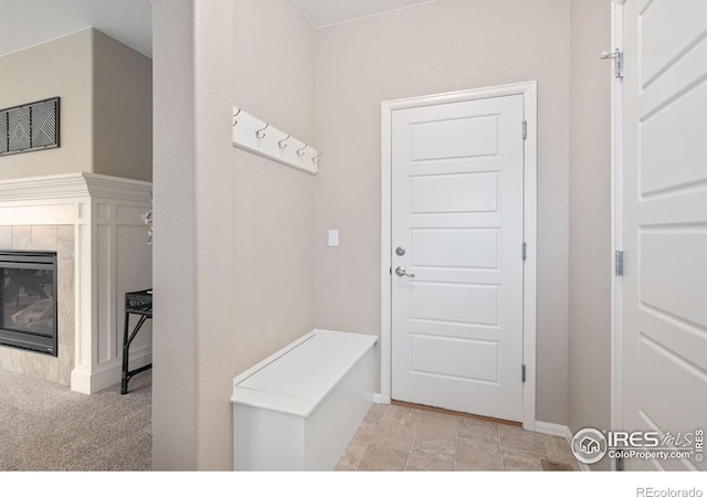 6492 Richland Ave, Timnath, CO 80547 - mudroom with baseboards and a tile fireplace