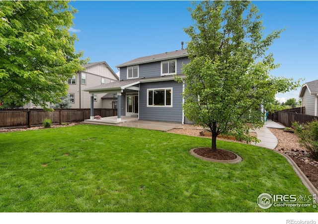 6492 Richland Ave, Timnath, CO 80547 - rear view of house with a patio area and a shingled roof