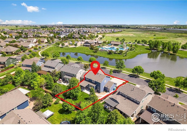 6492 Richland Ave, Timnath, CO 80547 - aerial perspective of suburban area featuring a large body of water and property parcel outlined