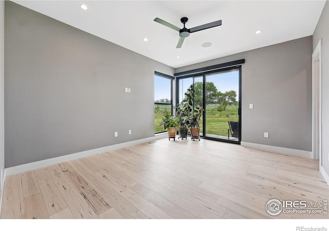 1563 Spring Creek Xing, Lafayette, CO 80026 - spare room with ceiling fan, baseboards, light wood-style floors, and recessed lighting