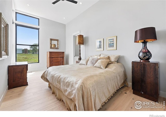 1563 Spring Creek Xing, Lafayette, CO 80026 - bedroom with high vaulted ceiling, light wood finished floors, baseboards, recessed lighting, and a ceiling fan