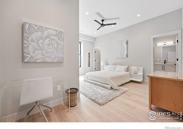1563 Spring Creek Xing, Lafayette, CO 80026 - bedroom with light wood-style floors, recessed lighting, ensuite bath, ceiling fan, and baseboards