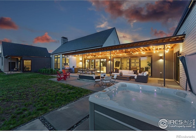 1563 Spring Creek Xing, Lafayette, CO 80026 - view of patio with a hot tub and an outdoor living space
