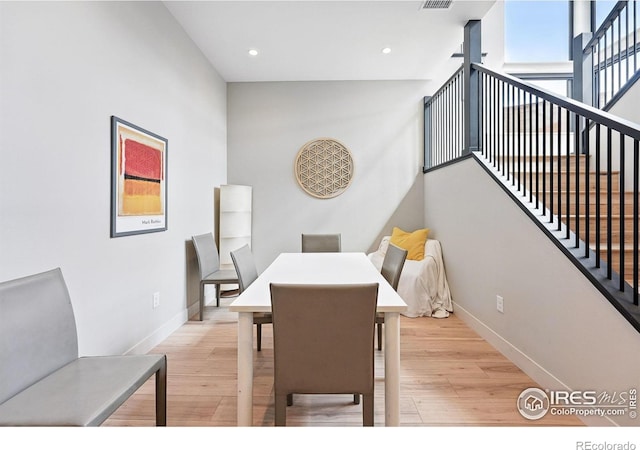 1563 Spring Creek Xing, Lafayette, CO 80026 - dining space with light wood-type flooring, baseboards, stairway, and recessed lighting