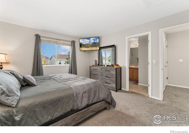 11096 Claude Ct, Northglenn, CO 80233 - bedroom with carpet flooring, multiple windows, baseboards, and ensuite bath