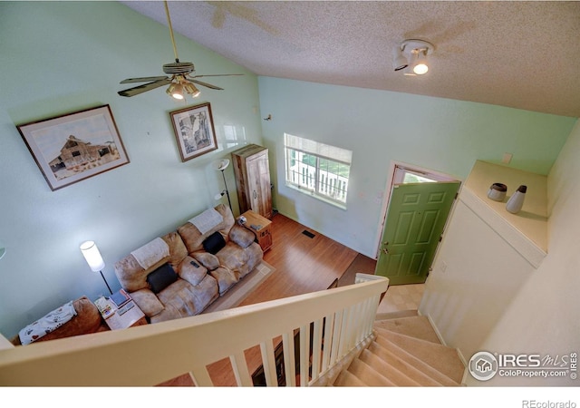 5241 E 128th Way, Thornton, CO 80241 - living area with a textured ceiling, ceiling fan, wood finished floors, and high vaulted ceiling