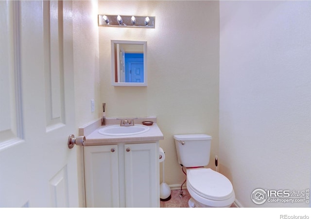 5241 E 128th Way, Thornton, CO 80241 - bathroom with vanity, toilet, and tile patterned floors