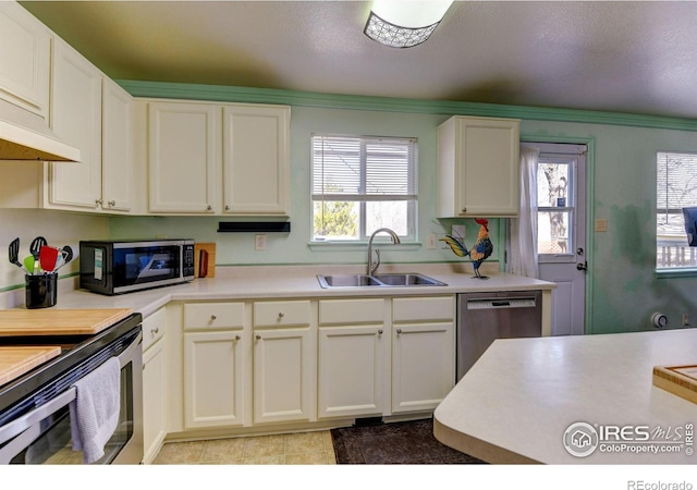 5241 E 128th Way, Thornton, CO 80241 - kitchen with appliances with stainless steel finishes, a sink, light countertops, tile patterned flooring, and white cabinetry