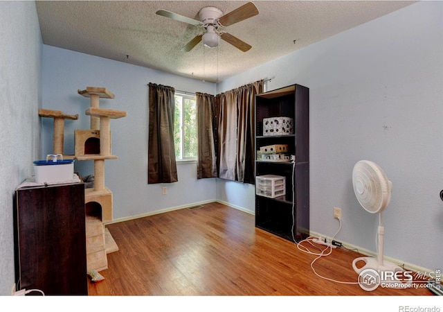 5241 E 128th Way, Thornton, CO 80241 - office space with wood finished floors, ceiling fan, a textured ceiling, and baseboards