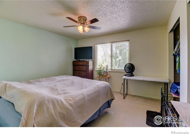 5241 E 128th Way, Thornton, CO 80241 - bedroom featuring carpet flooring, a textured ceiling, and ceiling fan