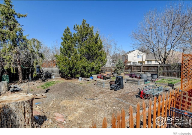 5241 E 128th Way, Thornton, CO 80241 - fenced backyard with a garden