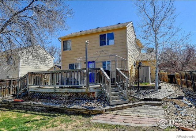 5241 E 128th Way, Thornton, CO 80241 - rear view of house with a fenced backyard and a deck