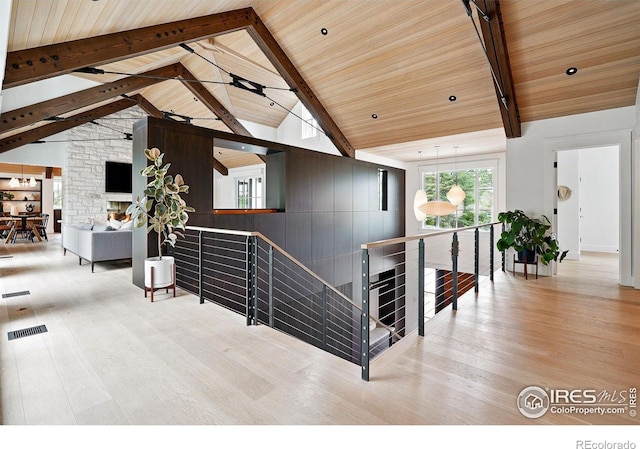 2100 Kohler Dr, Boulder, CO 80305 - stairway featuring wood finished floors, wooden ceiling with exposed beams, and high vaulted ceiling