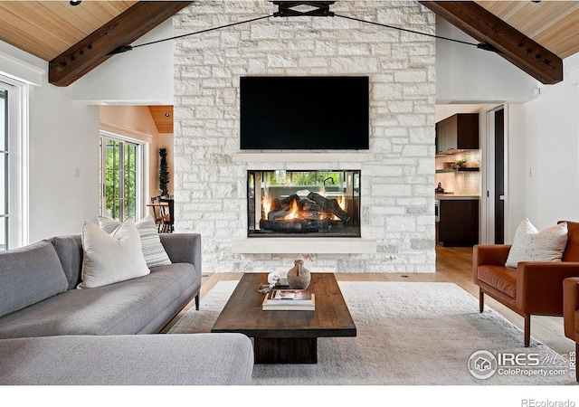 2100 Kohler Dr, Boulder, CO 80305 - living area featuring wood finished floors, wooden ceiling with exposed beams, a fireplace, and high vaulted ceiling
