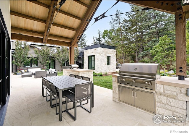 2100 Kohler Dr, Boulder, CO 80305 - view of patio / terrace with outdoor dining area, an outdoor structure, and an outdoor hangout area
