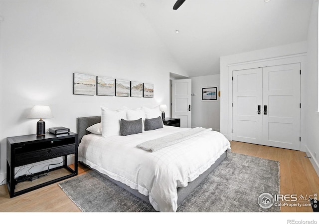 2100 Kohler Dr, Boulder, CO 80305 - bedroom featuring wood finished floors, a closet, a ceiling fan, and high vaulted ceiling
