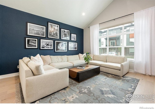730 Promenade Dr, Superior, CO 80027 - living area featuring wood finished floors, lofted ceiling, and baseboards