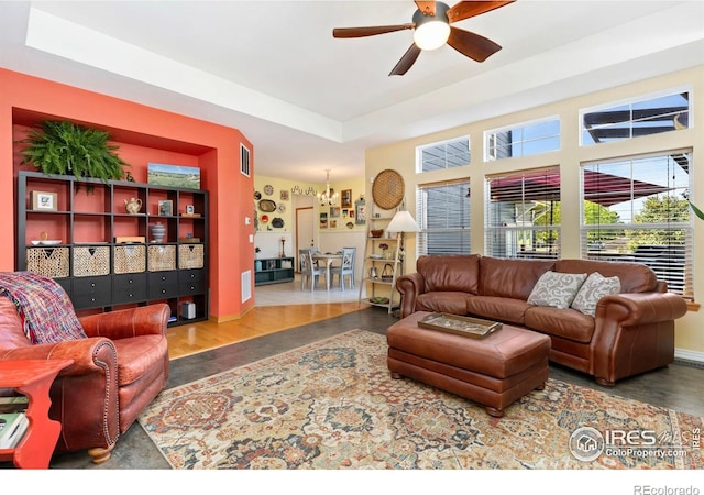 633 Deerwood Dr, Longmont, CO 80504 - living room featuring ceiling fan, a raised ceiling, and wood finished floors