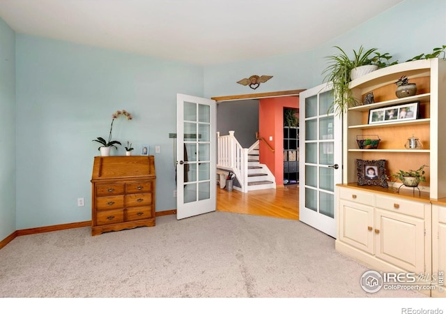 633 Deerwood Dr, Longmont, CO 80504 - sitting room with french doors and light colored carpet