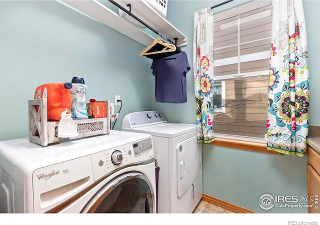 633 Deerwood Dr, Longmont, CO 80504 - washroom featuring washing machine and dryer and baseboards