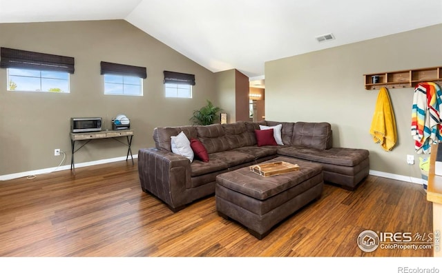 633 Deerwood Dr, Longmont, CO 80504 - living area featuring wood finished floors and lofted ceiling