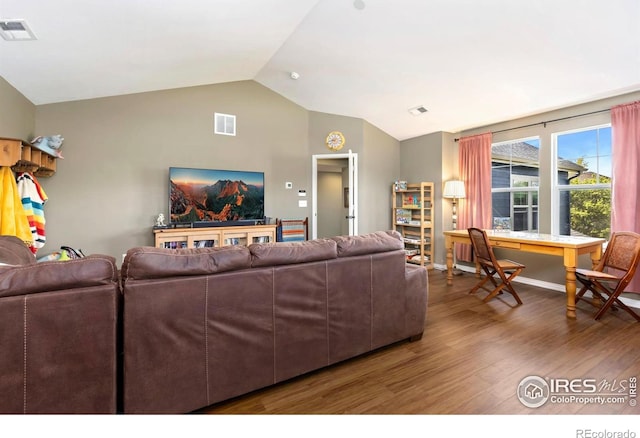 633 Deerwood Dr, Longmont, CO 80504 - living room featuring vaulted ceiling, wood finished floors, and a desk