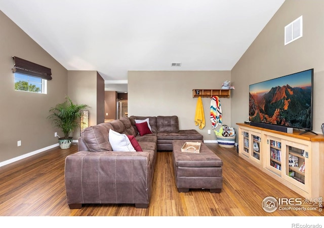 633 Deerwood Dr, Longmont, CO 80504 - living room featuring wood finished floors and lofted ceiling