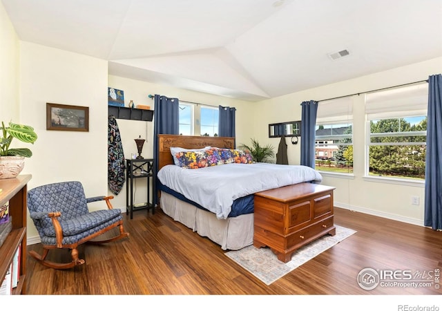 633 Deerwood Dr, Longmont, CO 80504 - bedroom featuring wood finished floors and lofted ceiling